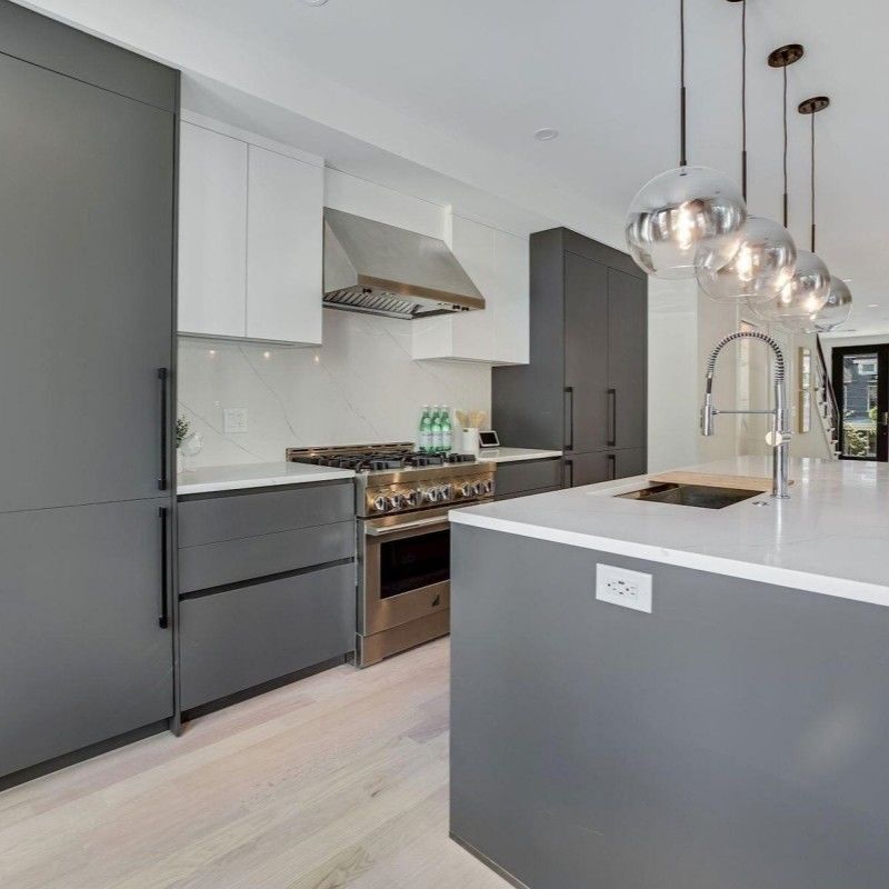 Convenient Lazy Susan Storage in Dark Pantry Unit Kitchen Cabinets with Blum Hardware